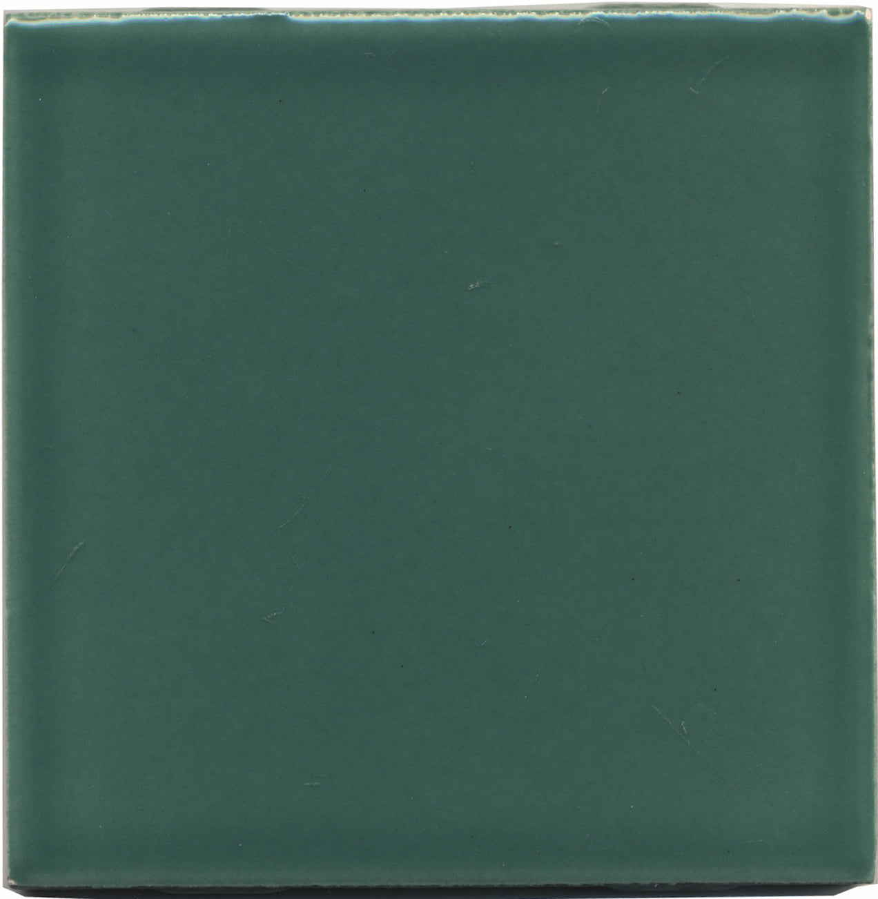 A single square-shaped ceramic tile in a dark jade-green color with a gloss finish.